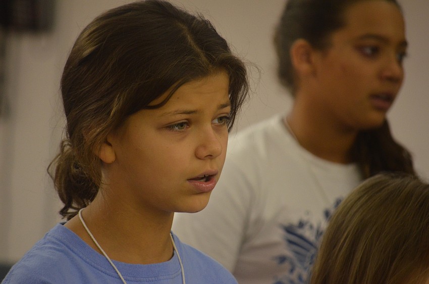 Emma Haos sings in tune with her campmates.