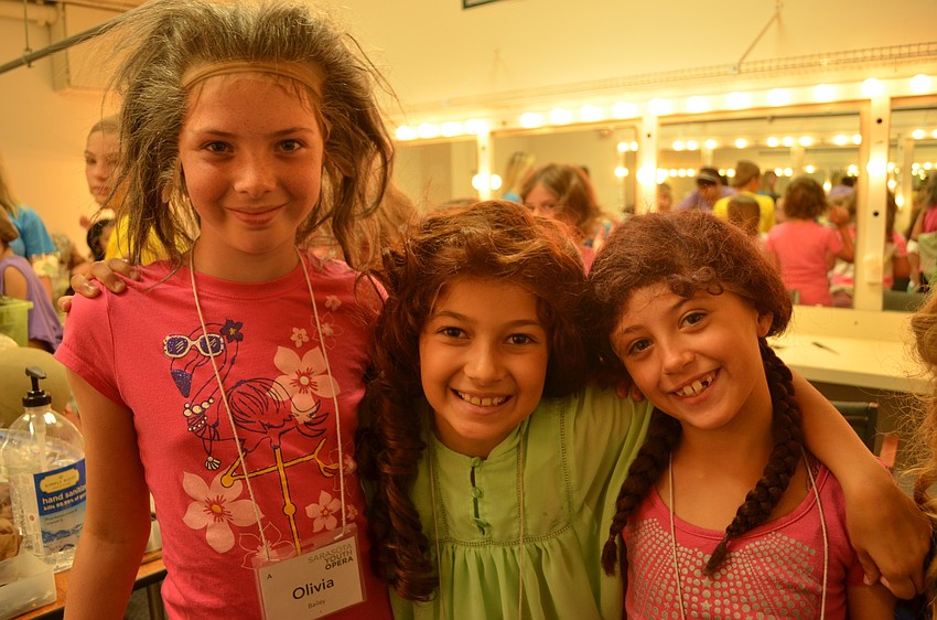 Olivia Bailey, Alexandria Hernandez and Julia Koren put on new hairstyles with each wig they tried on.