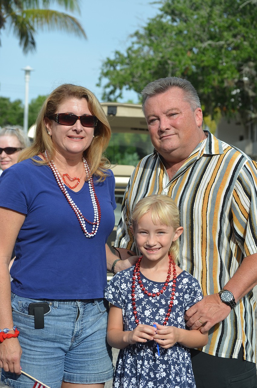 Lori Armstrong with her daughter Katie, 7, and husband Jim