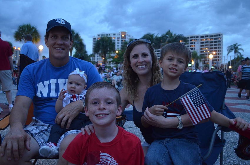 Richard Casper holds his six-month-old daughter Gracie and is surrounded by his son Bradley, 8, wife Catherine and son Benjamin, 5.