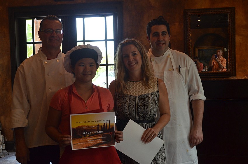Catering Chef Ken Smith, camper Kalei Ward, Event and Community Outreach Director Nikki Logan and Chef Jeff Sladky