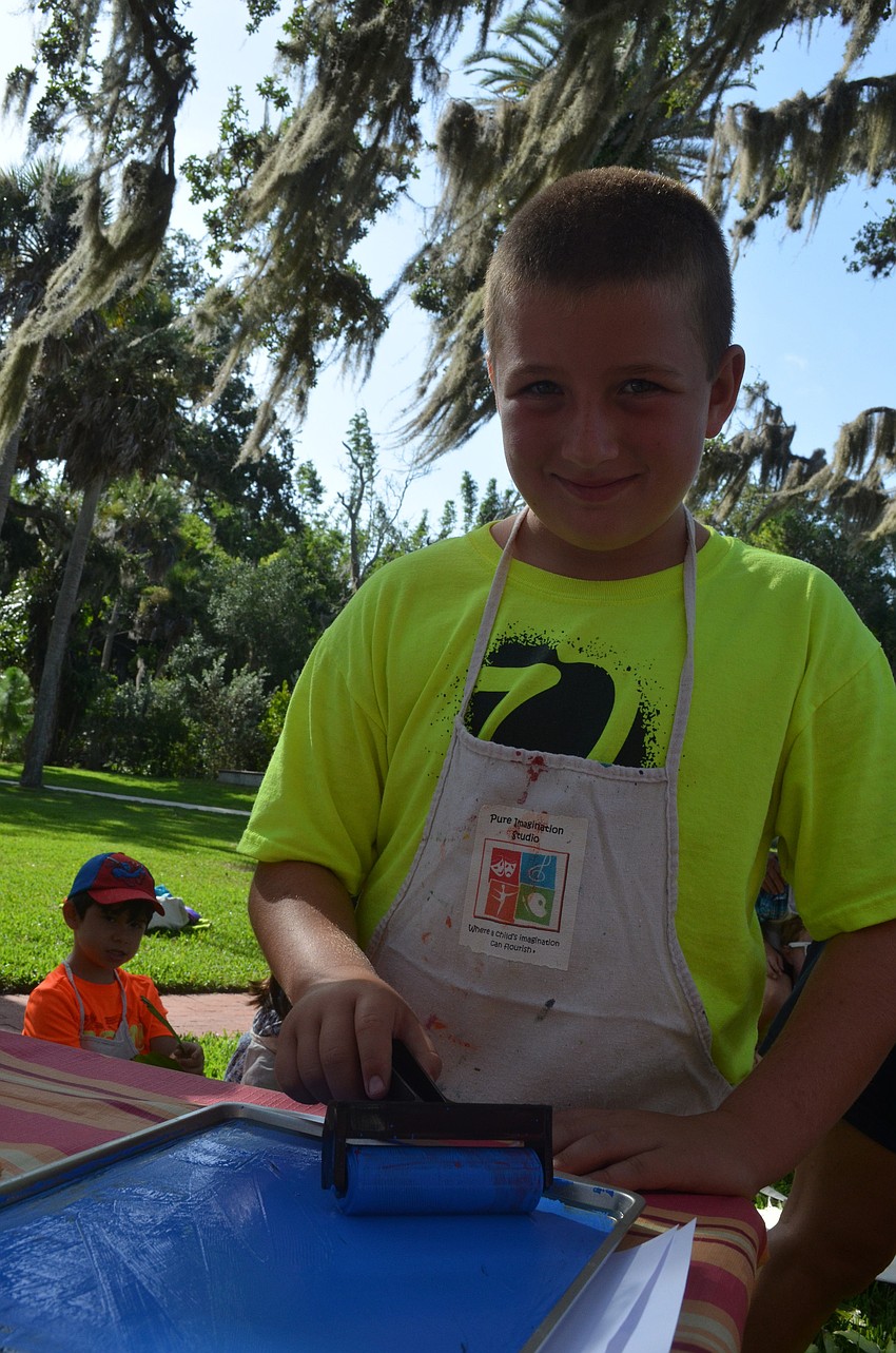 James Stewart, 8, works on his printmaking project.