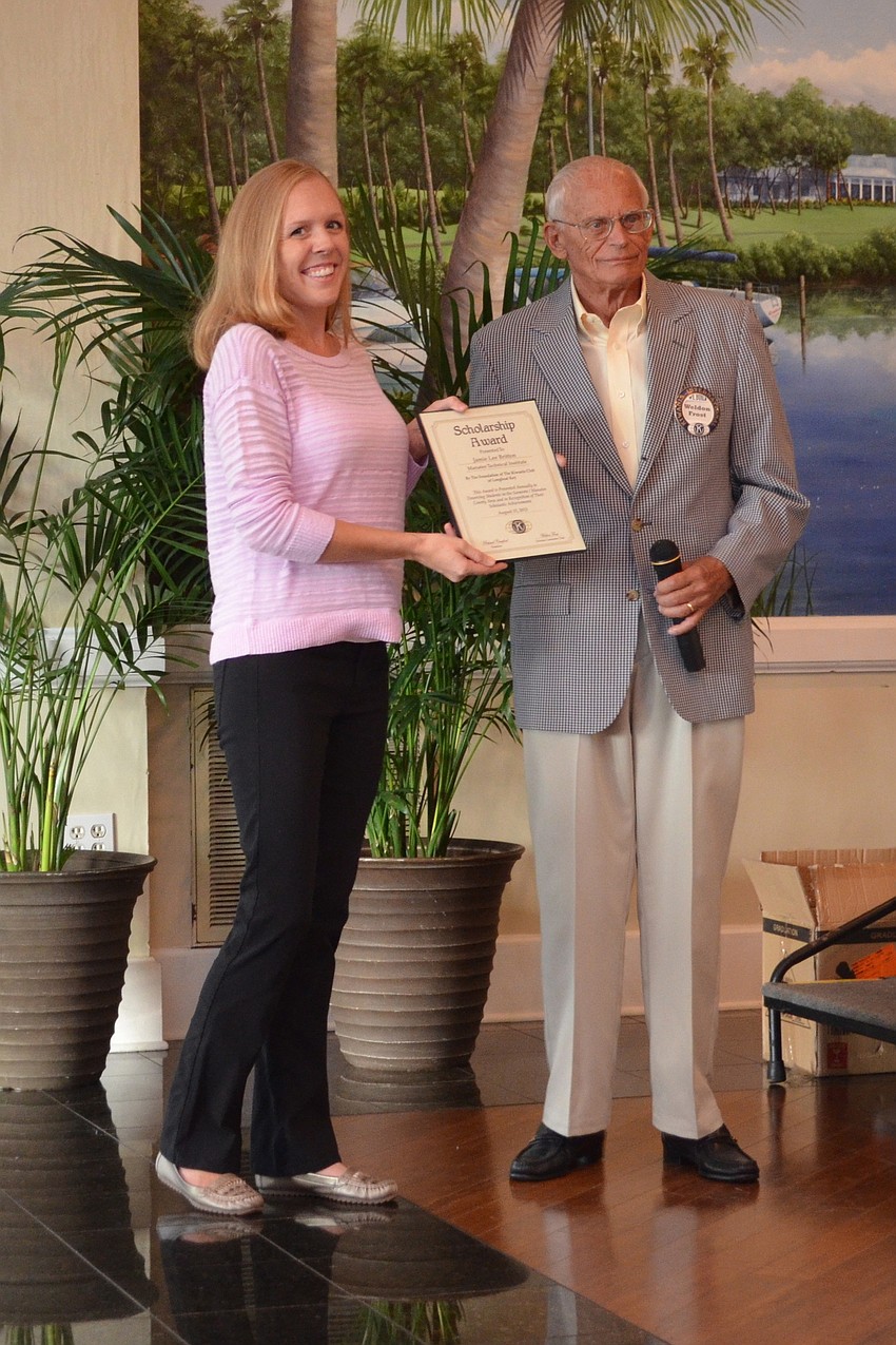 MTI student Jamie Britton accepts her scholarship certificate from Weldon Frost.