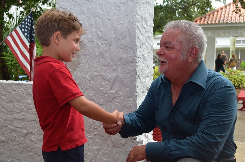 Samuel Dorrill meets Southside Elementary School Principal Steven Dragon.