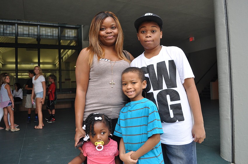 Erica Washington with her children, Eric, a seventh grader at Braden River Middle School, Erica and Steven