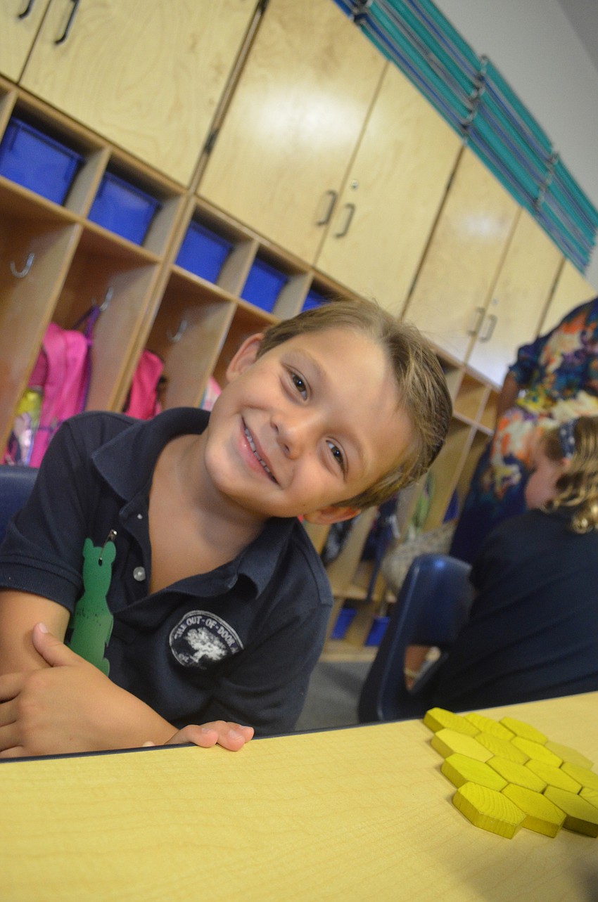 Tristan B. plays with blocks while he waits for kindergarten class to begin.