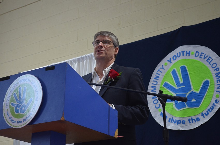 Chef Paul Mattison gives remarks after receiving his trophy. He advises youth to â€œfind something you love and go for it.â€