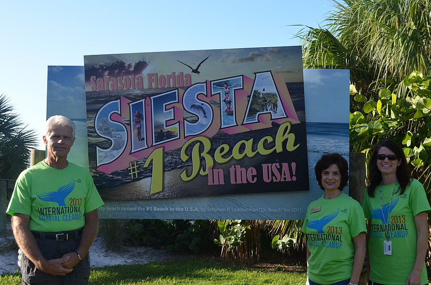 Jack and Candi Messerschmidt and Wendy Crisp registered people for the clean up Saturday morning.