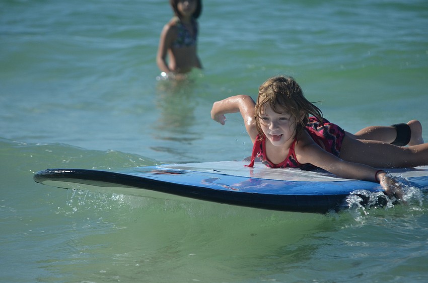 Isabelle Zamora, 6, learns to surf.