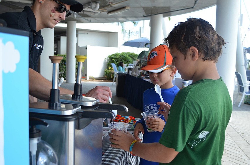 Peter Quaresima from Ben & Jerryâ€™s scoops ice cream for Ethan Quartermaine and Sebastian Kepecz