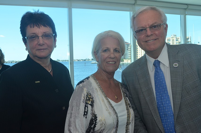 Linda de Mello of USF Sarasota-Manatee, Marlene Hauck of Sunshine from Darkness and Dennis Stover of USF Sarasota - Manatee