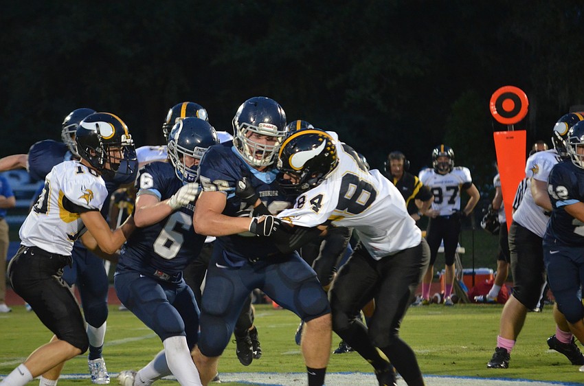 Linebacker Maxime Provost pushes through Bishop Verot.