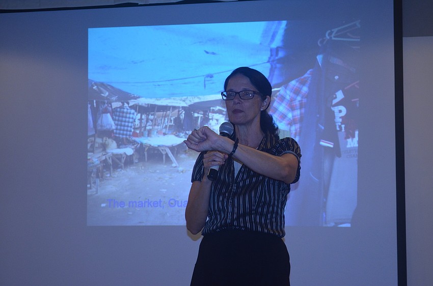 Pastor Kathy Wiggins speaks to parishioners and introduces the missions.