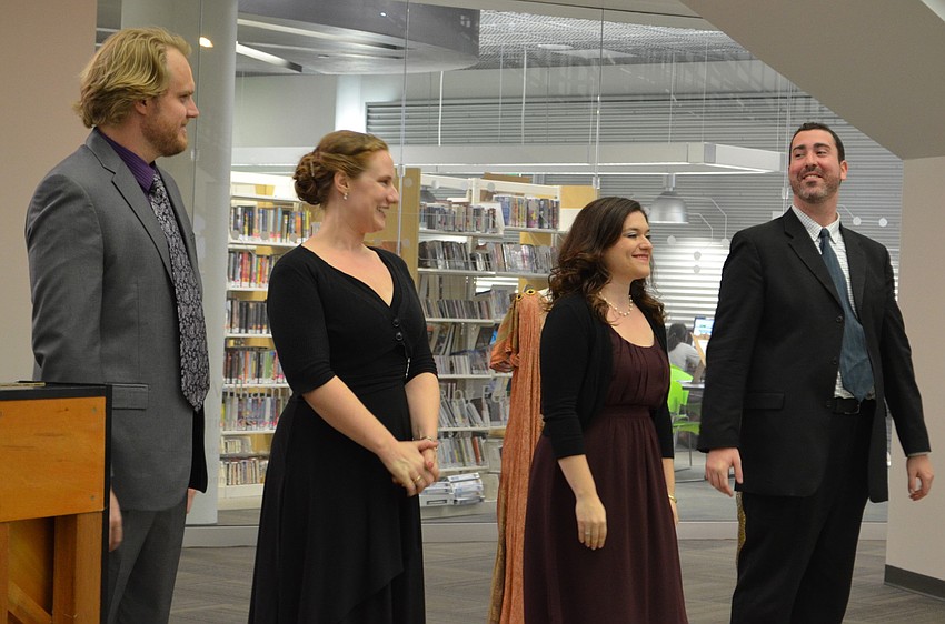 Tenor Marvin Kehler, Soprano Jennifer Townshend, Soprano Alexandra Batsios, and Bass-Baritone William Roberts perform for an audience at the library