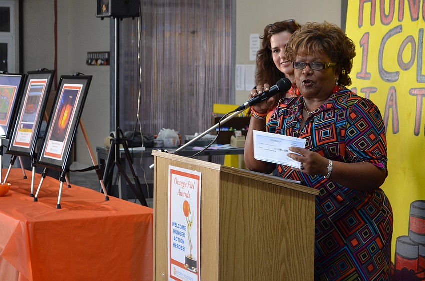 Aundrina Castleberry thanks Bank of America for the generous donation.