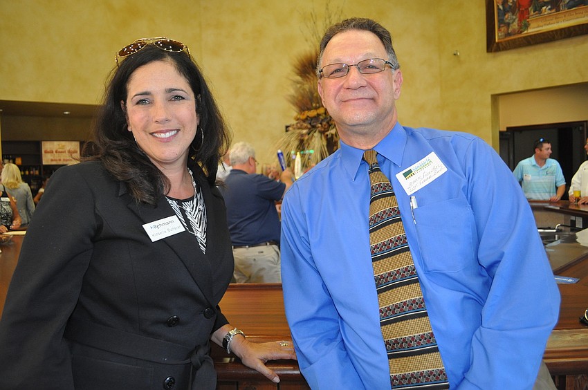 Kimberlie Buchanan of Rehmann CPAs and Mark Rosenthal of First Federal Bank