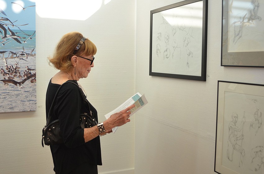 Gloria Weissberg admires some of the beautiful art displayed at the Longboat Key Center for the Arts.