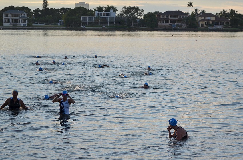 Triathletes swim in the Longboat Key Triathlon.