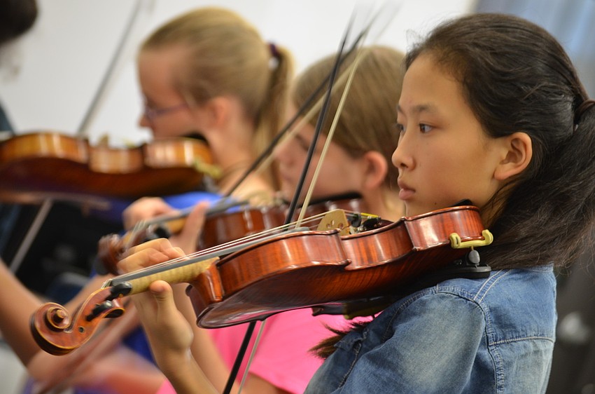 Cypress Potter, 13, attends Haile Middle School, and her sister Lily Potter, 11, also attends Haile Middle School; Lu Zhu, 13, attends Pine View Middle School