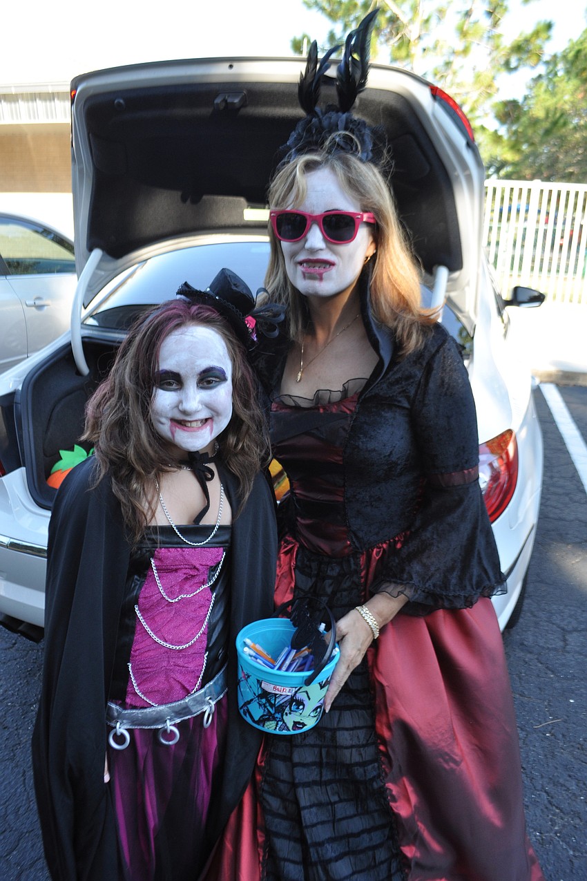 Bella Bauman, 9, passed out candy with her grandmother, Jill Bauman.