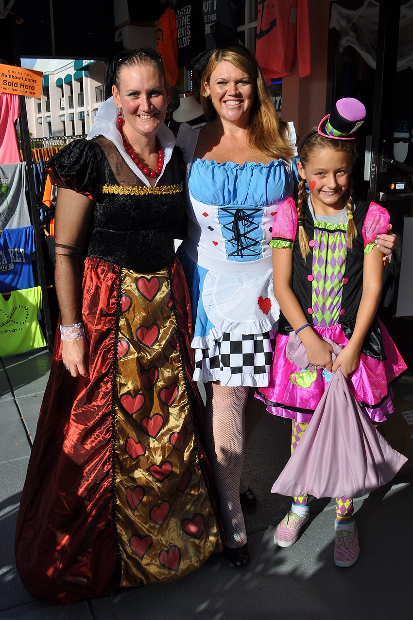 Kris Weccele, Lori Major and Kristina Seeley, 10, show off their Alice in Wonderland outfits.