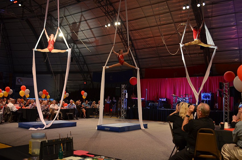 Sailor Circus performers dance on aerial silks