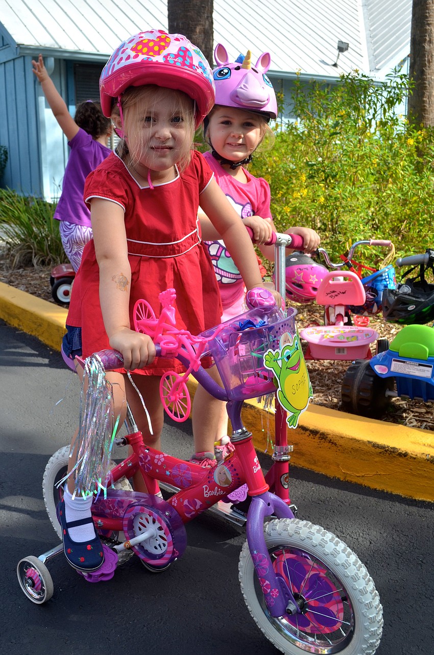 Sophie Duell, 4, and Brooke Meyers, 5, get ready to race.