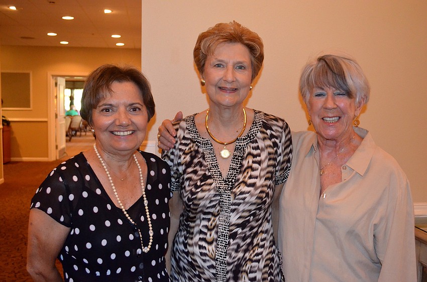 Fashion show models Barbara Robinson, Carol Darling and Linda Parker say goodbye to their everyday clothes for the next few hours.