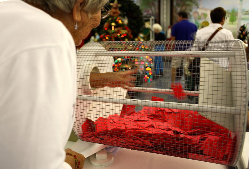 Sue Troup adds her tickets to the raffle.