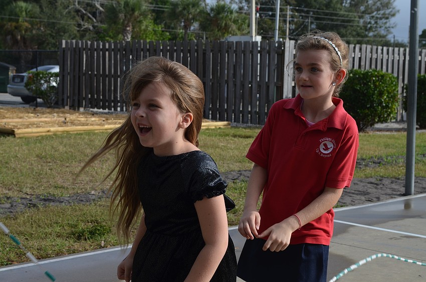 Patience Grathoff and Bridget Weccele jump together
