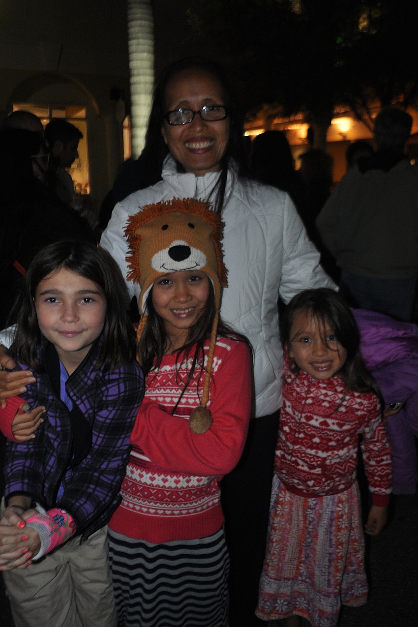Gwen Dodson, left, attends with her aunt, Charity Steckel, and cousins, Mirav Steckel, center, and Chaya Steckel, right.