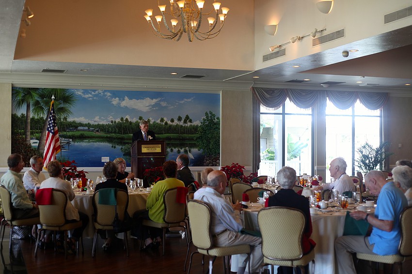 President Murray Blueglass welcomes members with club announcements and the Pledge of Allegiance.