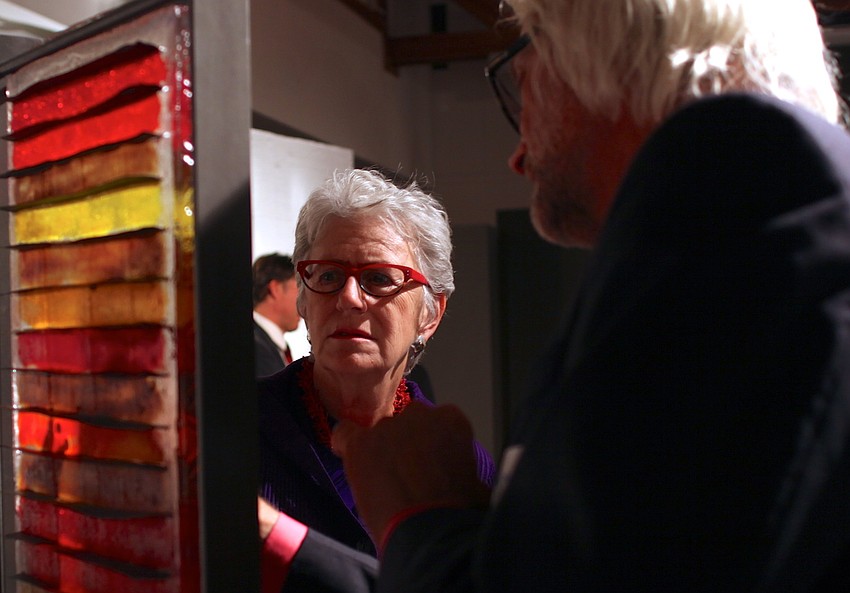 Nancy Zimmerman and Thomas Coates discuss a piece.