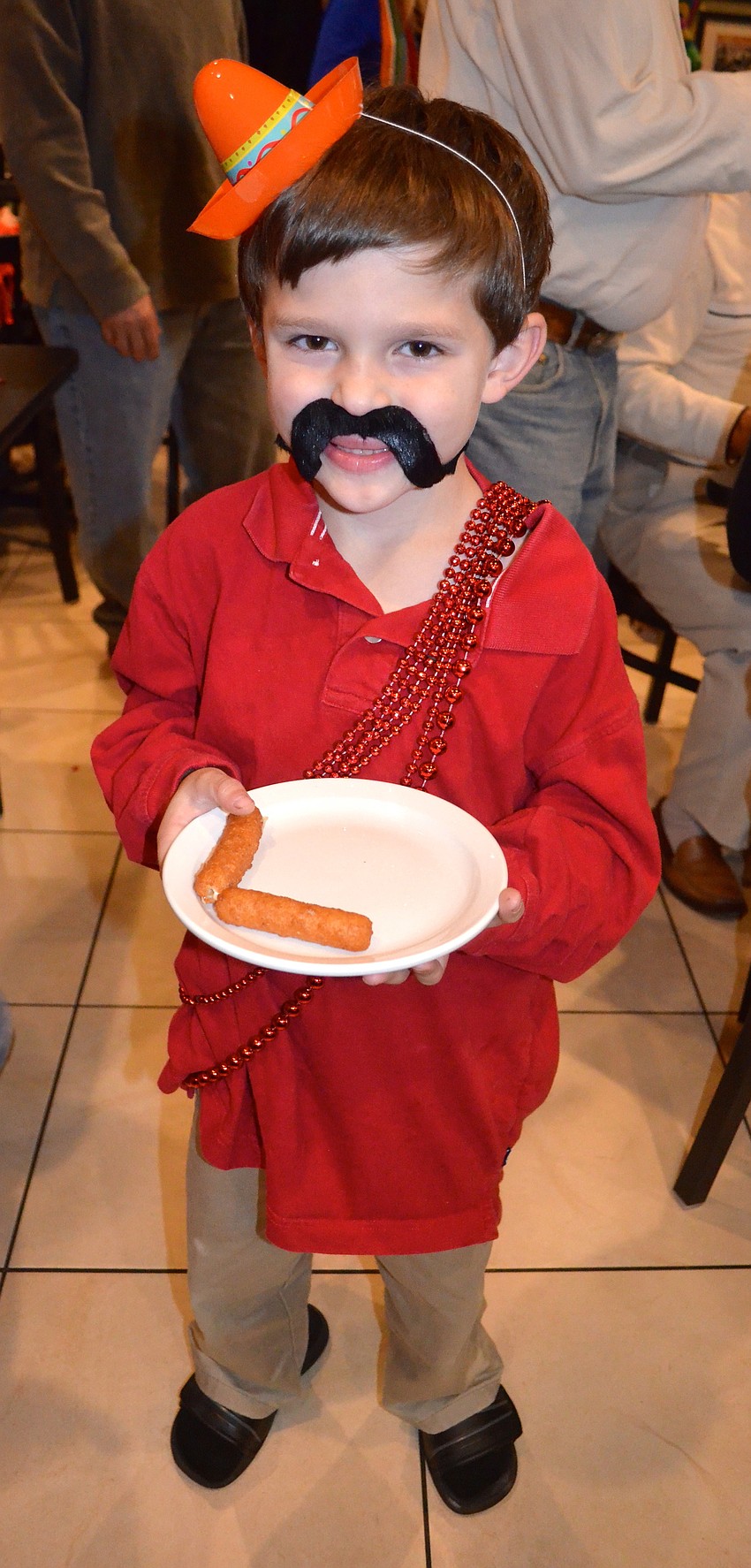 Nico Juliano, 6, shows off his newly-acquired facial hair.