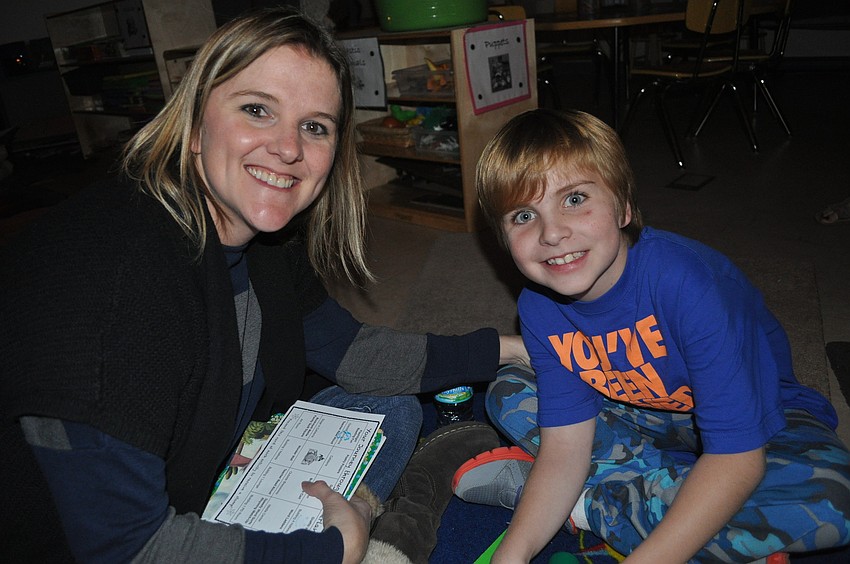 Cherri Wade helped her son, Ryan Shaver, a fourth-grader, read Greek mythology.