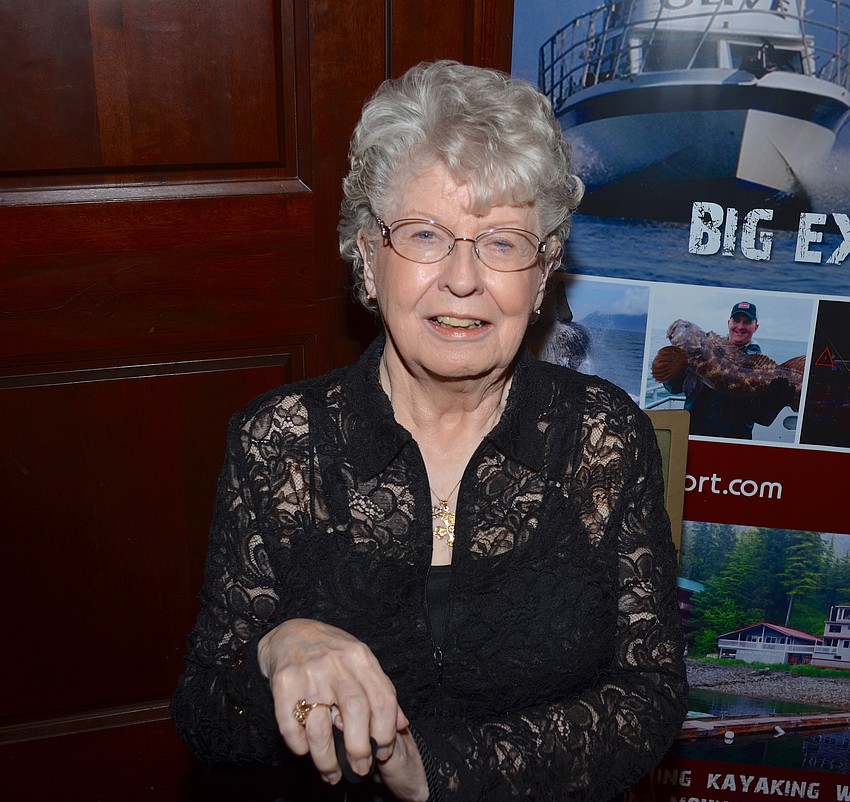 Helen Drizos takes a minute away from the crowd before dinner.
