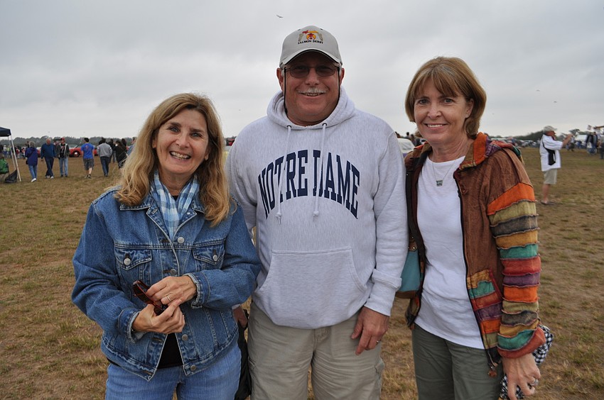 Cascades resident Pat Hittner, right, came out with her brother, Mike Hampel, center, and neighbor, Fran Cino, left.