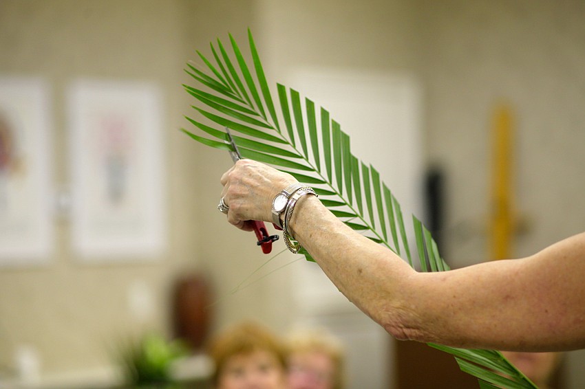 Sherry Linhart demonstrates how cutting leaves on different angles can add to the appeal of an arrangement.