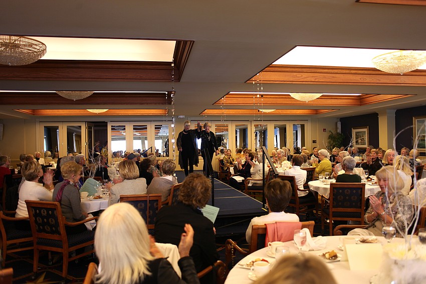 The crowd claps for model Jan Grzep and designer Joan McGee.