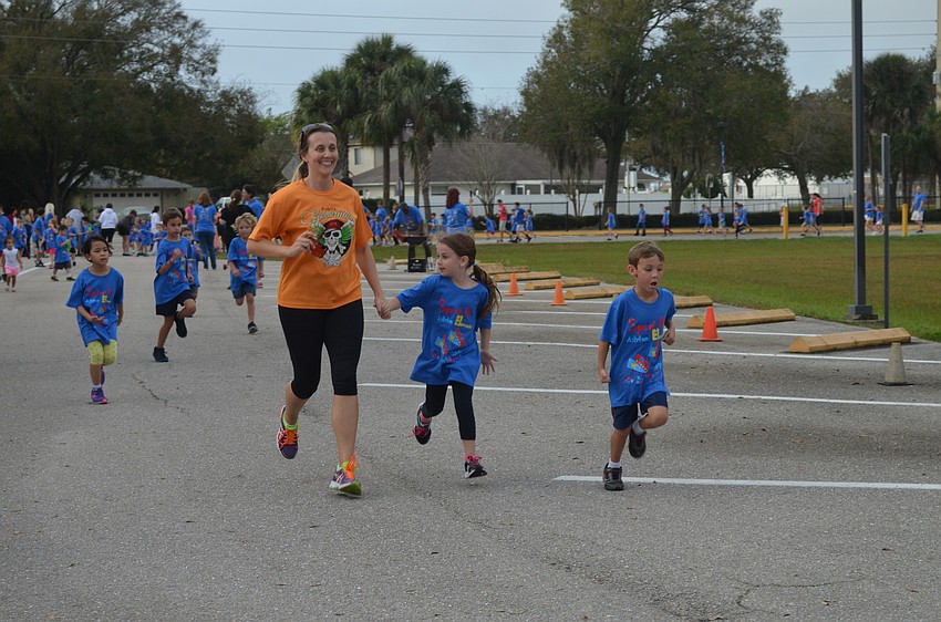 Sara Pruett and mom, Georgia, run hand-in-hand.