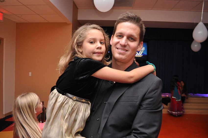 Elise Coad, 7, dances with her father, Steve.