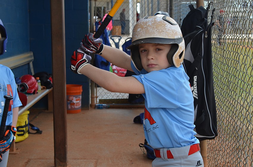 Steven Row puts on his game-face in the dugout.