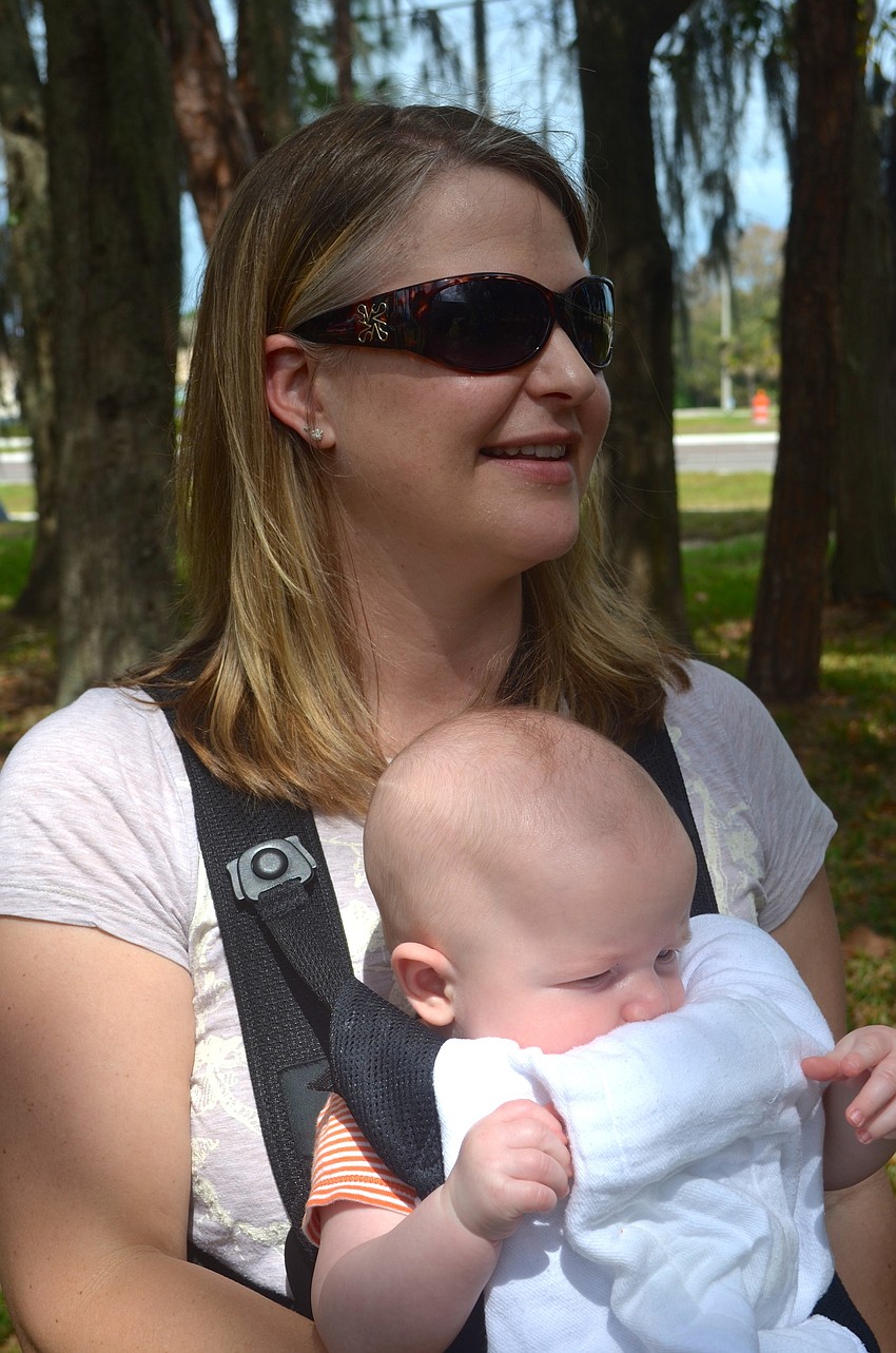 Dena Butler relaxes in the shade with her four-month-old son, Bennett.