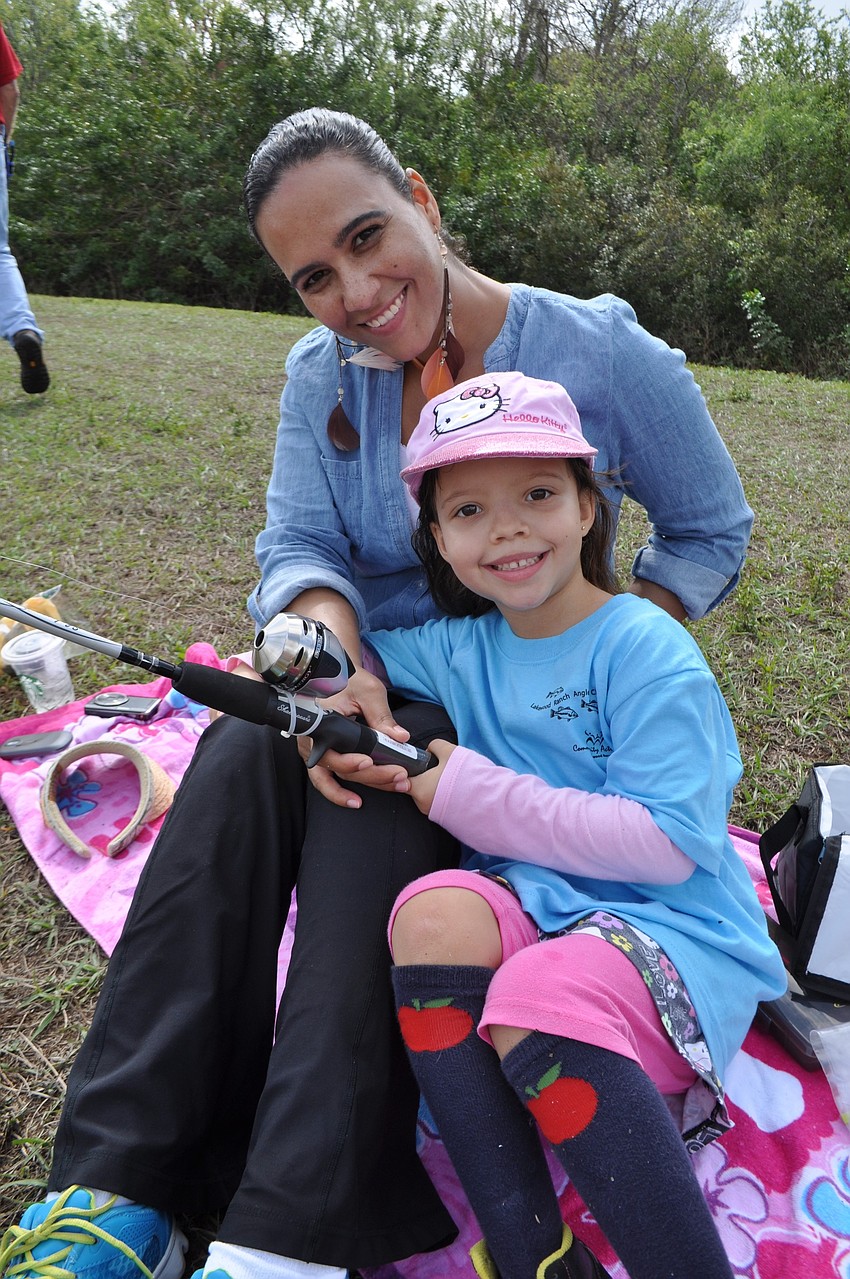 Fanny and Erica Hintermeyer enjoy Ericaâ€™s first time fishing.
