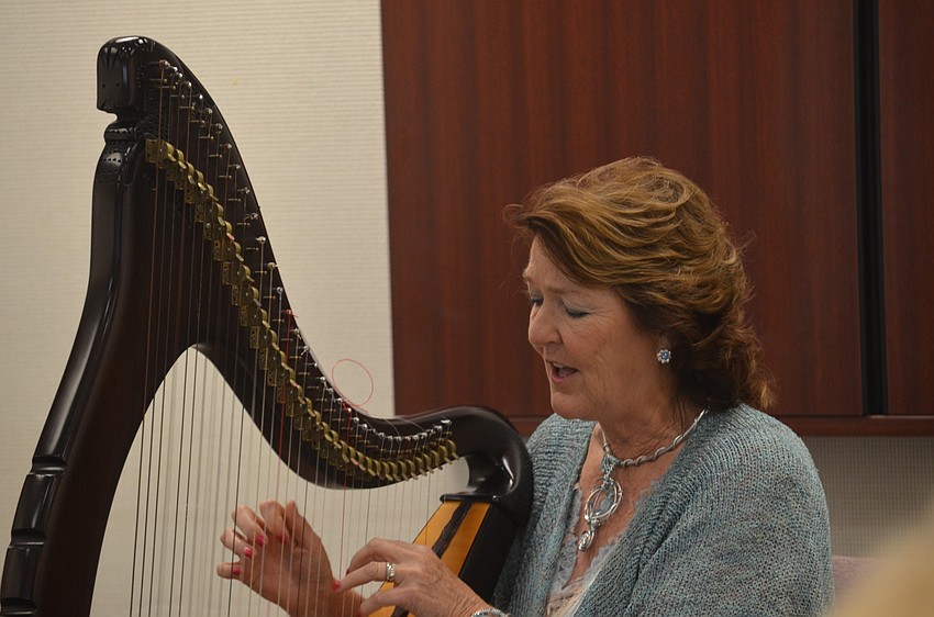 Olivia Swann performs Irish folk songs on her harp.