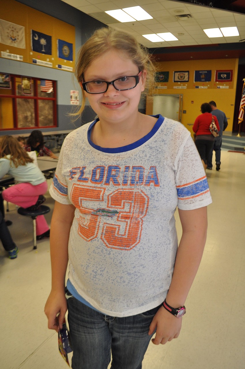 Brooke Lounds, 10, wins a game pen.