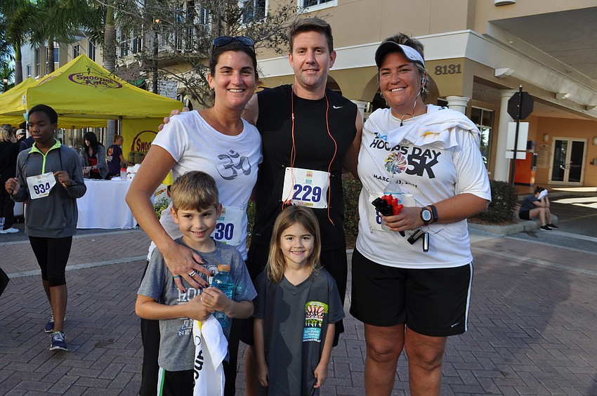 Barrington Ridge residents Shelbi and Tom Ericsson run with their children Hunter and Harper, front, and Shelbiâ€™s sister, Stephanie Weaver, who is visiting from out of state.