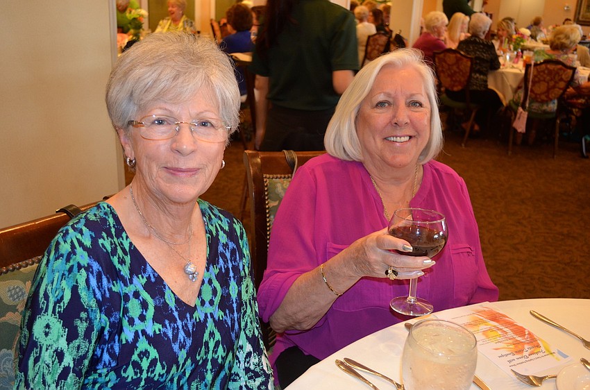 Elsa Merkel and Rosemary Jelisks enjoy cocktails.