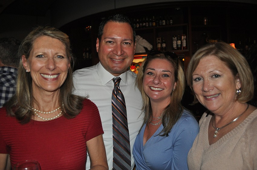 Patricia Courtois with Octavio Ortiz, the general manager of the Mall at University Town Center, and his wife, Jessica, and Lynda Jencks
