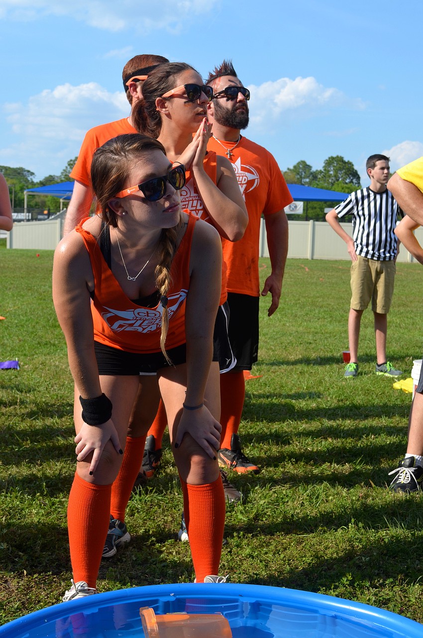 Becca Fox and the orange team wait for the event to begin.
